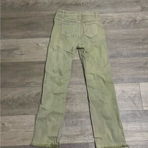 Women’s green distressed jeans